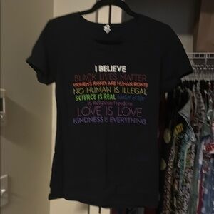 I Believe Black Graphic T-Shirt with Multicolor Text